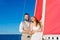 Newlyweds traveling in a sailing boat