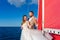 Newlyweds traveling in a sailing boat