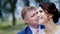 Newlyweds walk near the river