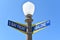 NEWPORT BEACH, CALIFORNIA - 14 SEPT 2021: Lamppost with street signs for South Bay Front and Abalone Avenue, on Balboa Island
