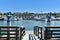 NEWPORT BEACH, CALIFORNIA - 14 SEPT 2021: Public Dock on Balboa Islands looking across the channel towards the mainland