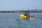 NEWPORT BEACH, CALIFORNIA - 24 AUG 2020: Lifeguard boat Sea Watch II in the Entrance Channel with the Jetty in the background