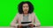 News anchor, woman face and speaker with green screen talking with notes. Reporter, speech and female presenter in