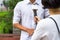 News journalist with microphone interviewing on street closeup