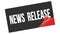 NEWS  RELEASE text on black red sticker stamp