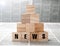News title on square wooden blocks in the shape of a pyramid on newspapers