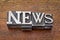 News word in metal type