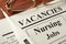 Newspaper with ads nursing jobs vacancy.