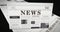 Newspaper: NEWS. Seamless digital loop background. NEWS headline on newspaper in front of press. Animation on black