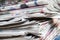 Newspapers folded and stacked on the table. Closeup newspaper and selective focus image