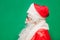 Newyear atmosphere presents, wear red santa costume sunglass headwear. isolated green color background