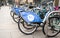 Nextbike bicycle rental bikes on stand mixed with privately owned bike on street
