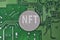 NFT coin on printed circuit board. Electronic board and NFT technology. Rolling out new NFT technology