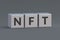 NFT inscription on cubes. Non-fungible token. Blockchain technology concept