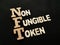 NFT Non Fungible Token, text words typography written with wooden letter, future digital asset