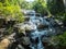 Ngao Waterfall, Beautiful Scenic Waterfall Surrounded by Various of Trees in The Forest in National Park of Ranong