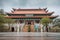 Ngong Ping, Hong Kong - Woman under Umbrella outside Po Lin Monastery Buddhist Temple