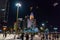 NHA TRANG, VIETNAM - APRIL 20, 2019: Tourists fly kites at night in the square near the lotus building