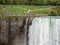 Niagara Falls, New York and Canada [ edge of Niagara falls, town from American and Canadian city side, falling water and mist ]