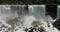 Niagara Falls tourists on Goat Island river water edge misty 4K