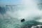 Niagara Horseshoe Falls with a touristic vessel Maid of the Mist approaching. The falls height is 57 m and they throw