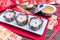 Nian Gao or sticky rice cake and red envelope Cash Gift on wooden background