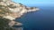 Nice aerial top view flight drone Sunset cliff hiking Ibiza island tower Spain