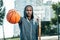 Nice Afro American man having a basketball training