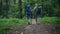 Nice aged couple walking in teh forest