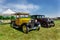 Nice amazing front view of classic vintage cars with people in background