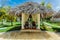 Nice amazing view of cozy inviting gazebo in tropical garden on sunny gorgeous day