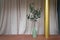 Nice artificial plant in ceramic vases setting on empty brick bench with gold column in minimal modern style apartment /