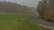 Nice asphalt road in dark misty day near Luhacovice town in Moravia