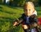 Nice baby boy playing with flower