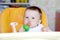 Nice baby eats fruits by using nibbler