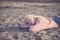 Nice beautiful caucasian young girl lay down sleeping and relaxing on the sand at the beach. vacation no stress leisure activity