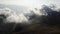 Nice cinematic Aerial view of summit of mountain with clouds at autumn.