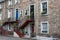 Nice colourful stairs to a front door at a stone house in Edinburgh