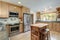 Nice country home wood kitchen with wooden island and ligth green tiles