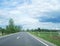 Nice country road with blue sky and white clouds