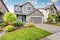 Nice curb appeal of two level house, mocha exterior paint and concrete driveway