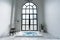 Nice design jacuzzi bathtub with high transparant window in natural light setting scene / cozy interior concept