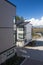 Nice development of new townhouses. Rows of townhomes side by side. External facade of a row of colorful modern urban townhouses.