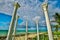 Nice dramatic view of stylish old wedding gazebo columns standing on Cuban Varadero beach against dark blue sky background