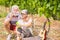 Nice elderly people senior adult play together outdoor in the nature with bubble soap like young guys. together forever in love