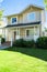 Nice entrance of residential house with concrete pathway over the front yard