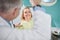 Nice female patient smiling in dental chair