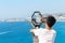 Nice, France - 16.09.16: Boy looking through binoculars on a flying parachute in a beautiful sea in Nice,France .