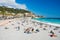 NICE, FRANCE - April 22, 2017: People sunbathing and relaxing on the beach in Nice, France.