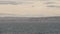 NICE, FRANCE - MARCH 8, 2023: Slow motion panoramic shot of plane landing in Cote D Azur airport